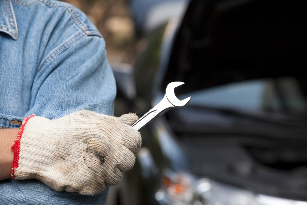 car mechanic holding the wrench