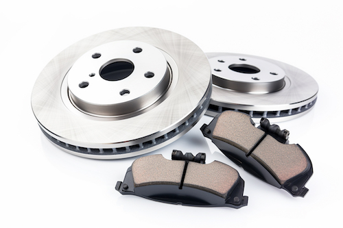 car brakes beside brake pads