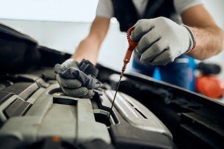 Tulsa mechanic performing an oil change service